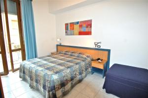 Postel nebo postele na pokoji v ubytování Albergo Rossella