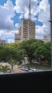 a view of a city with a large building at Hotel Real Paulista in São Paulo