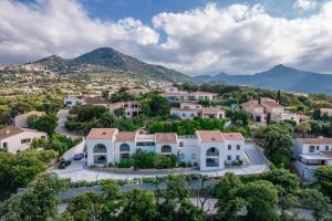 an aerial view of a village with houses and mountains at La Listrella Residence & Spa in Monticello