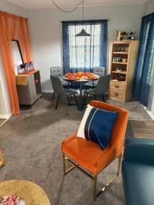 a living room with a table and chairs at Urban Oasis in Jacksonville