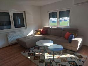 a living room with a couch and a table at Apartment King in Travnik