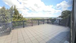 a balcony with a view of a city at Copou Luxury Suites in Vaslui