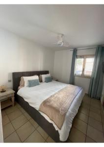a bedroom with a large bed with a ceiling at Apartamento Kai in Playa Jandia +23 photos