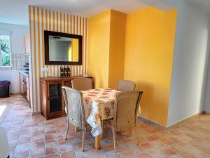 a dining room with a table and chairs at Villa Cala Encantada Sea View Apartments with Pool in Calpe +97 photos
