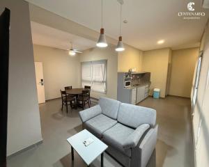 a living room with a couch and a table at ALOJAMIENTO CENTENARIO in Corrientes