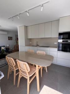 a kitchen with a table and chairs in a room at Terraza Montaña in Nerja +7 photos