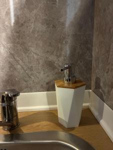 a bathroom with a sink and a faucet at TiTò Apartment in Naples +48 photos