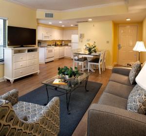 a living room with a couch and a table at Waterside by Spinnaker Resorts in Hilton Head Island