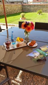 a table with a tray of food on it at La Ferme du bois Paris in Ermenonville-la-Petite