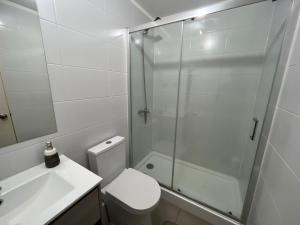 a bathroom with a shower and a toilet and a sink at laguna verde apart in Los Ángeles