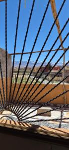 a view from the top of a wooden structure with a blue sky at Panoramic House - Midelt Family Triplexe in Midelt