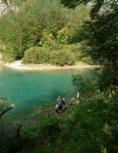 a group of people riding horses near a body of water at Vikendica Bistrica in Mojkovac