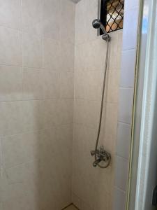 a shower with a shower head in a bathroom at Studio VAI in HUH +15 photos