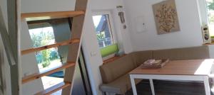 a small room with a couch and a table at Dom Leśny in Wachów