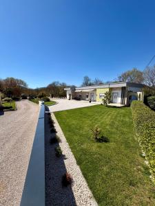 a house with a garden and a driveway at AS Holiday Home in Ljubuški