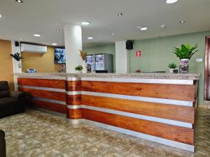 a bar in the lobby of a hospital at Hotel Rubinos in San Salvador
