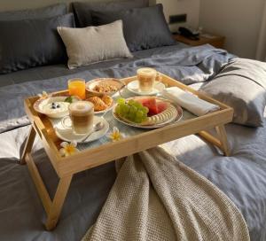 a tray of food on a table on a bed at Casa Benita in Hvar