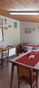 a group of tables and chairs in a room at Posada La Maison D Agustine in Colón