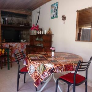 a dining room with a table and chairs with a tableablish at Posada La Maison D Agustine in Colón +11 photos