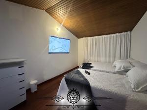 a bedroom with a large bed and a window at Casa Hotel Imperion in Bogotá