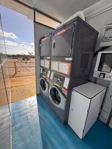 a washer and dryer in a room on a boat at Lomas de Balsares in Elche