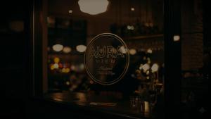 a reflection of a sign in a window of a restaurant at AURA View in Nuwara Eliya
