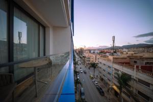 a balcony of a building with a view of a city at Suites Nador in Nador