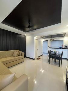 a living room with a couch and a table at The SOS Pad in Pila