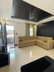 a living room with a couch in a room at The SOS Pad in Pila