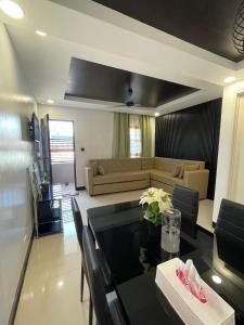 a living room with a table and a couch at The SOS Pad in Pila