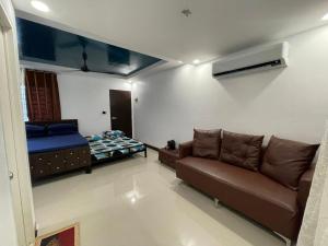 a living room with a couch and a bed at The SOS Pad in Pila +19 photos