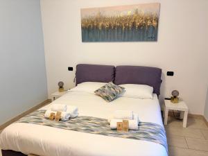 a bedroom with a bed with two pillows on it at Belvedere in Costa - Lake View in Bellano