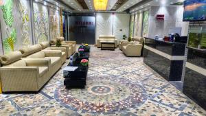 a lobby with couches and chairs and a table at Star International Rajshahi - Near Aam chattar in Rājshāhi