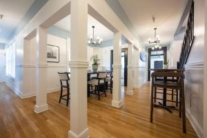 a dining room and living room with a table and chairs at BytheSea Inn in Half Moon Bay
