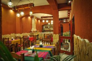 a restaurant with tables and chairs in a room at Hostel Copacabana La Quiaca in La Quiaca +67 photos
