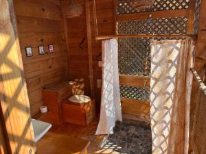 an inside view of a wooden cabin with a window at Lake Atitlán Panorama Chalets in San Marcos La Laguna