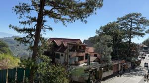 a group of houses on the side of a street at Suntrust88 Tower1-Unit 4Y in Baguio