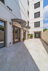an external view of a building with a walkway at Dedinje Luxury Apartment with Spa & Garage in Belgrade
