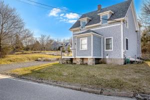 a house on the side of a street with a driveway at Acadia View Cottage Peaceful, Pet Friendly, Fire Pit, Near Peaks and Echo Lake in Hall Quarry