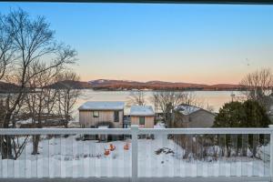 a view from the balcony of a house in the snow at Phoenix Aerie Birds-Eye Harbor Views, Maritime Loft, Harbor Watch Sunrise Deck in Southwest Harbor