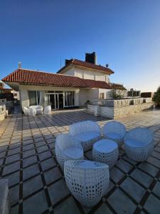a group of chairs sitting on a patio at Villas with direct sea views and apartments with partial sea views in Miami, Alexandria, Al Safwa Tower, in Alexandria