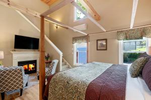 a bedroom with a bed and a fireplace at Captain Swift Inn in Camden