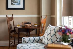 a living room with a chess board on a table at Captain Swift Inn in Camden