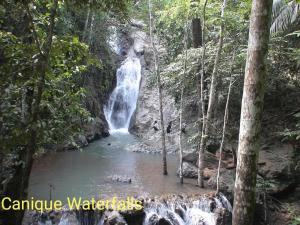 a waterfall in the middle of a pool of water at El Nido Bayview in El Nido