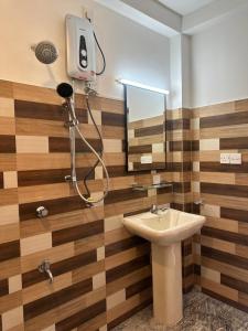 a bathroom with a sink and a shower at Dacha Retreat in Midigama East