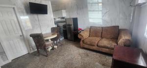 a living room with a couch and a table at E & E Motel in Myrtle Beach