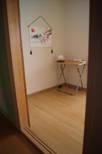 a room with a desk and a table in a room at sakurazaka in Tanabe +21 photos