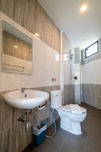 a bathroom with a sink and a toilet at Rim Apartment Pattaya in Pattaya South +56 photos