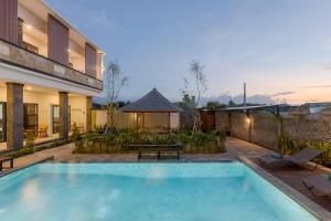 a swimming pool in the backyard of a house at DC 08 Residence in Dalung