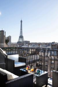 a balcony with a view of the eiffel tower at Eiffel Tower View in Paris